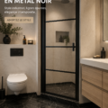 Porte de douche en verre noir avec cadre industriel dans une salle de bain moderne.