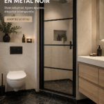 Porte de douche en verre noir avec cadre industriel dans une salle de bain moderne.